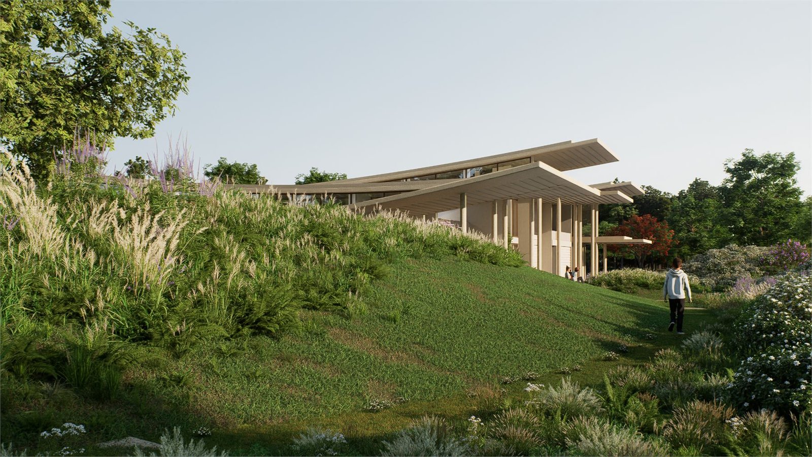 Farmhouse trail through planted berms with architecture beyond